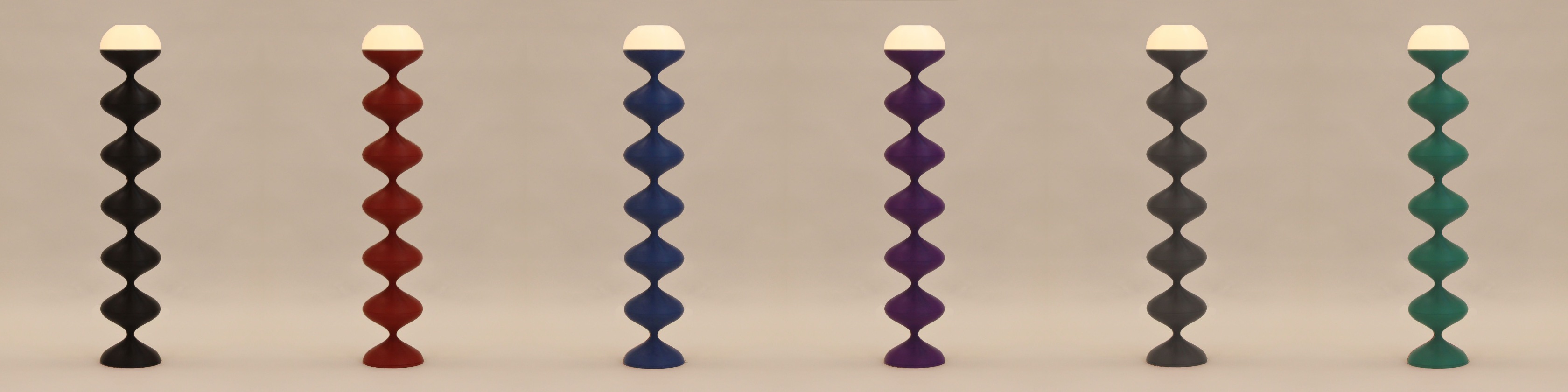 The Squiggle Lamp shown in six matte colors